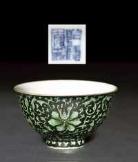 A green and black enamelled teabowl